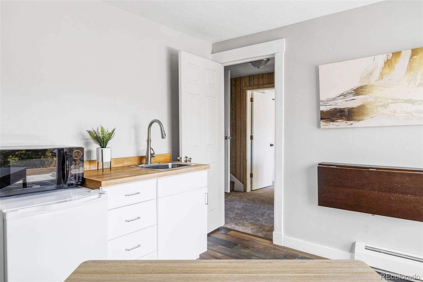 297 Deer Path Road Dillon, CO 80435 - Photo 35 of 49 a kitchen with sink and mirror
