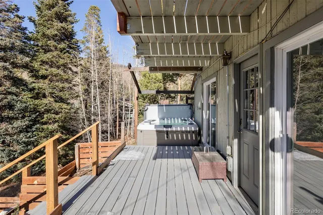 a view of a patio with table and chairs