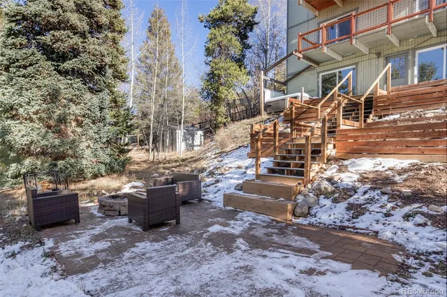 a front view of a house with yard and seating area