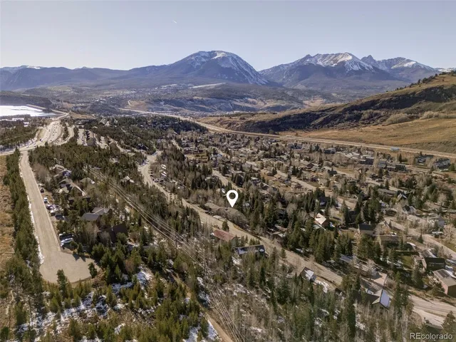 an aerial view of residential house and green space
