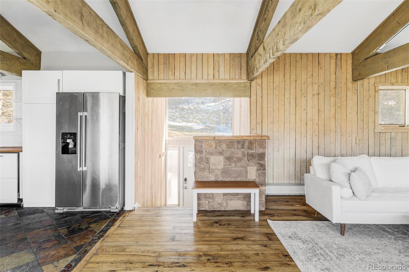297 Deer Path Road Dillon, CO 80435 - Photo 5 of 49 a living room with furniture and a fireplace