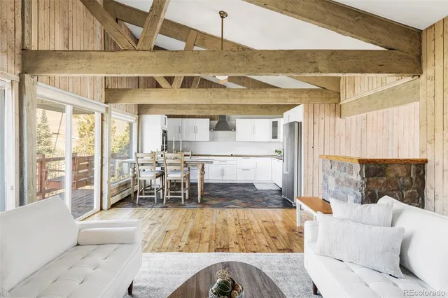 a living room with furniture and a table