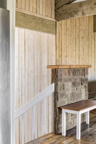 a view of wooden floor and chair in a room