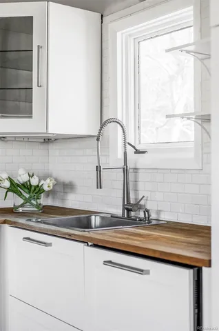 a bathroom with a sink and a window