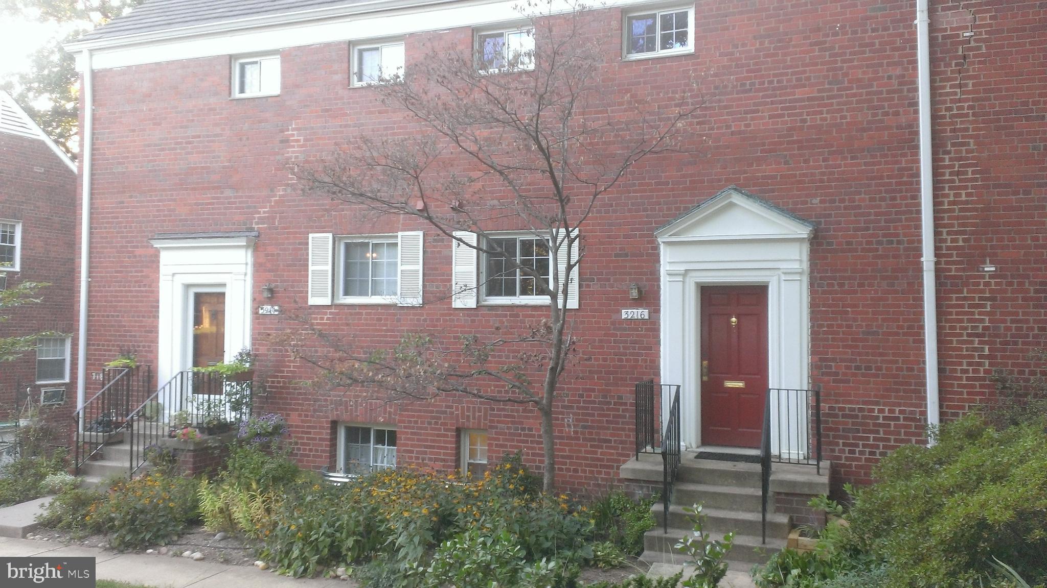 3216 Gunston Road Alexandria, VA 22302 - Photo 2 of 15 a brick building with a large windows