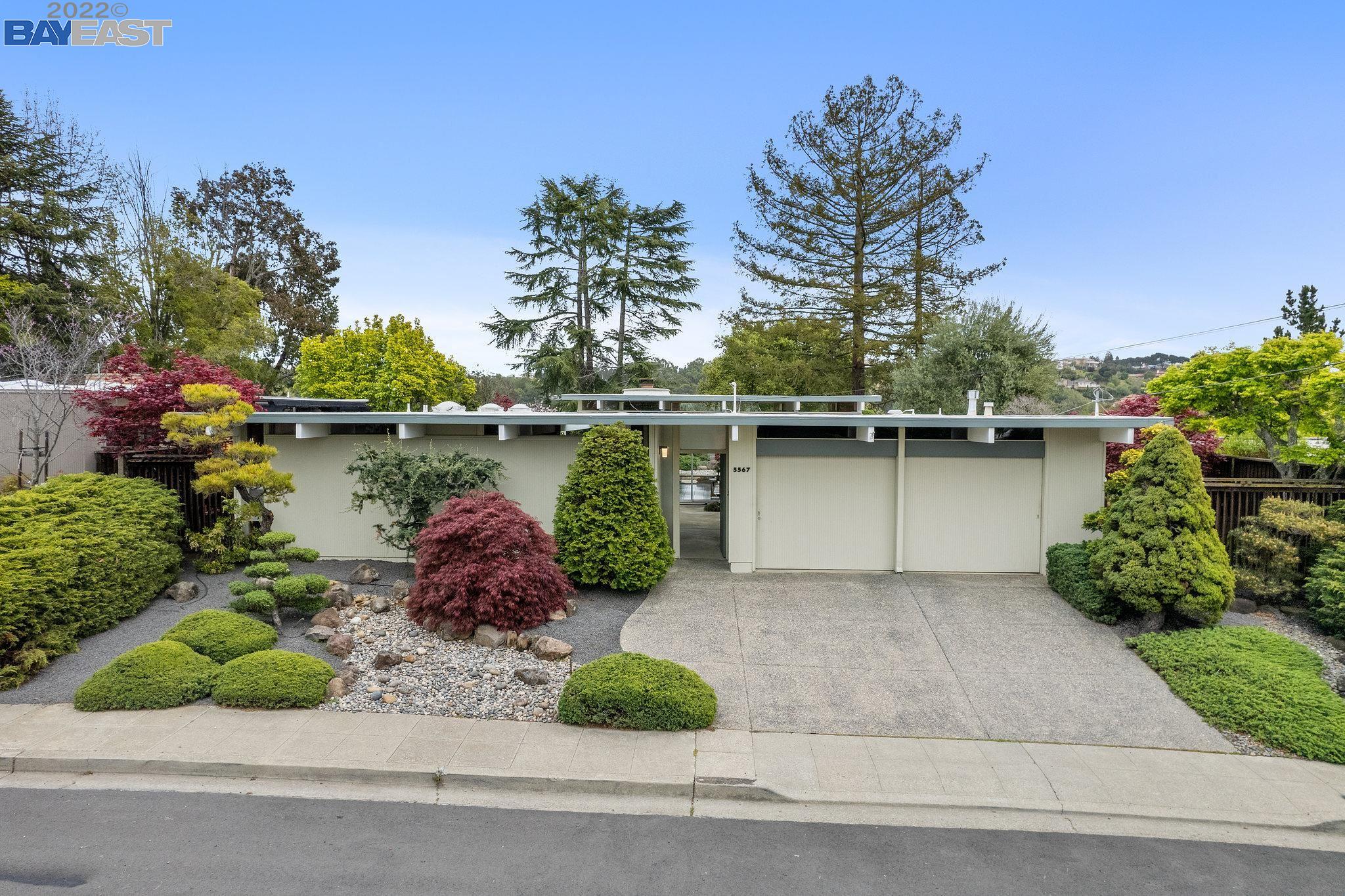 a lake view with a bench and trees