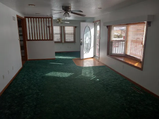 a kitchen with a sink cabinets and window