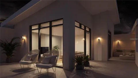 a view of a livingroom with furniture and a potted plant