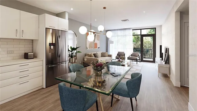 a view of a dining room with furniture a chandelier and wooden floor