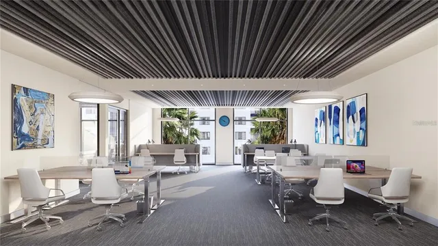 a living room with furniture and floor to ceiling window