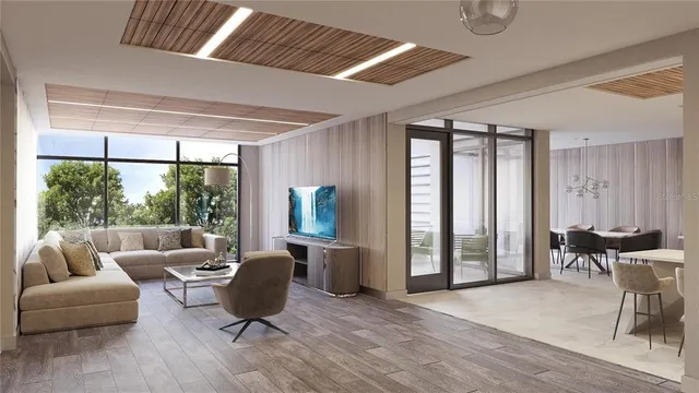 a living room with furniture and large windows