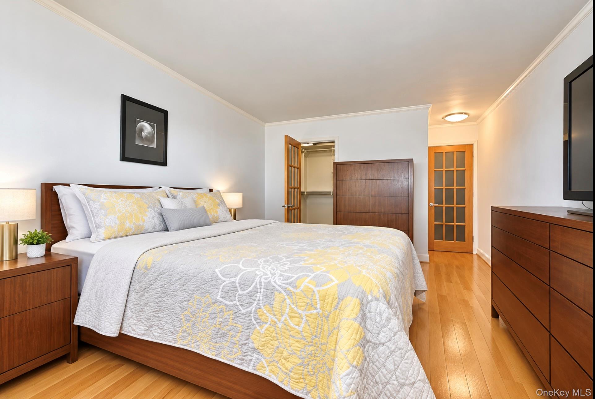 102-30 66th Road, Unit 17E Queens, NY 11375 - Photo 13 of 21 Hardwood-style flooring throughout, accompanied by light-toned wall finishes
