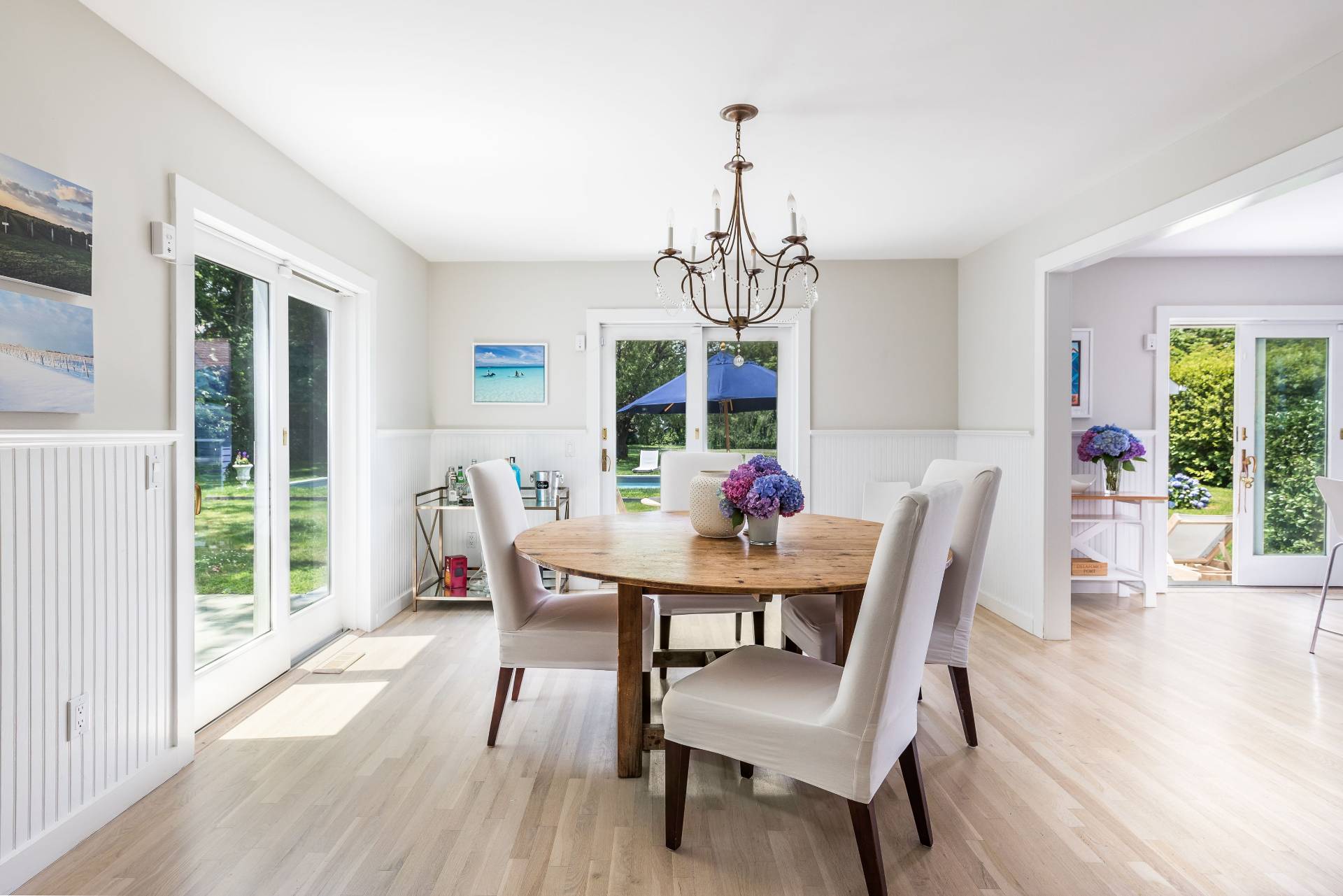 124 Ocean Road Bridgehampton, NY 11932 - Photo 11 of 27 a view of a dining room with furniture window and wooden floor