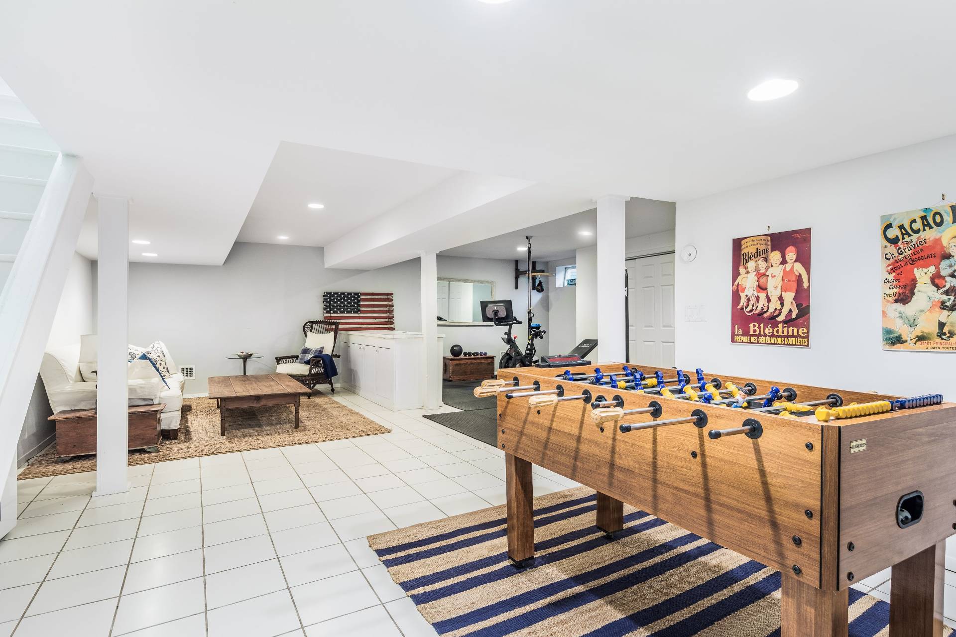 124 Ocean Road Bridgehampton, NY 11932 - Photo 21 of 27 a living room with furniture a flat screen tv and kitchen view