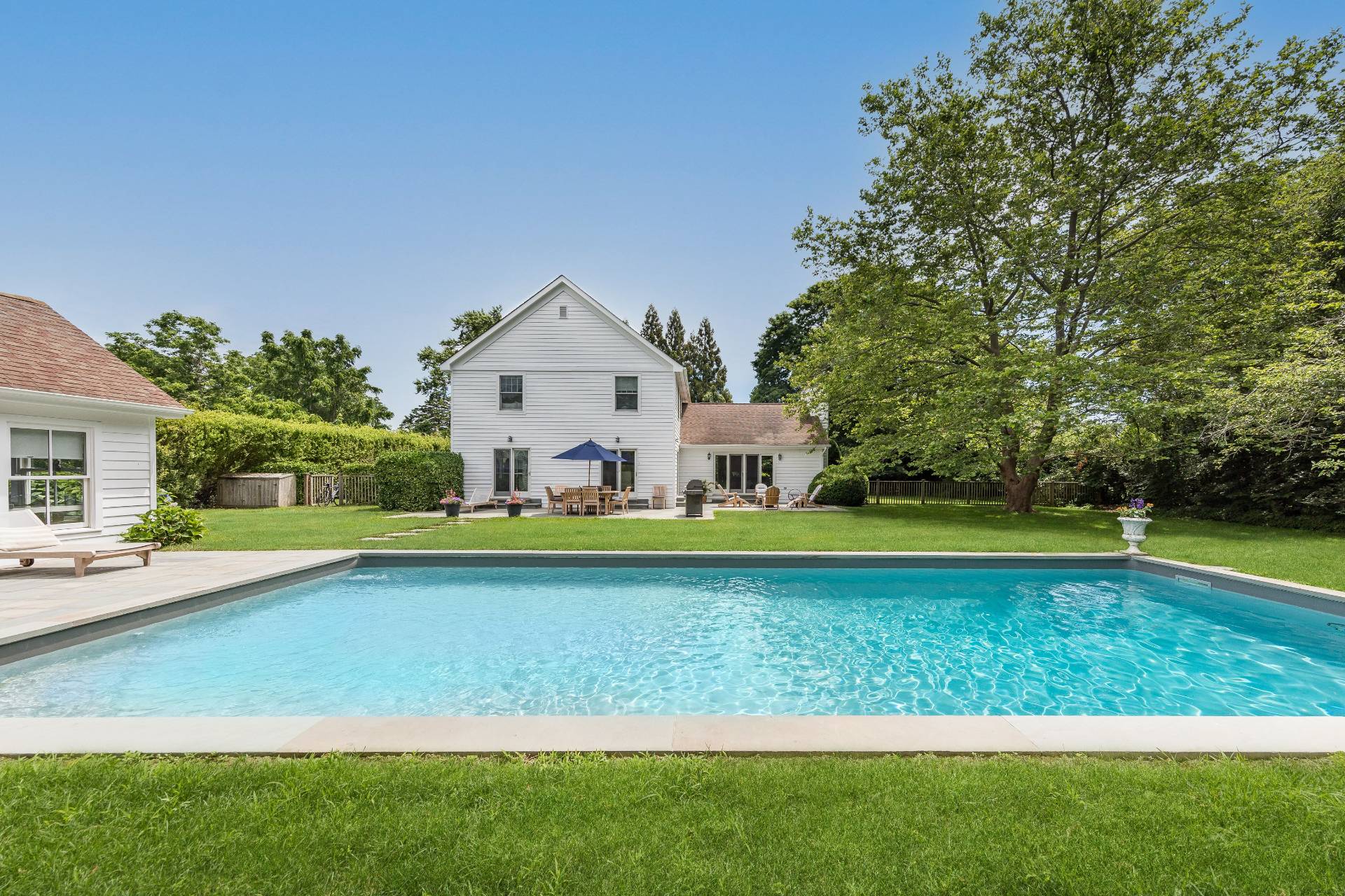124 Ocean Road Bridgehampton, NY 11932 - Photo 26 of 27 a front view of house with yard and swimming pool