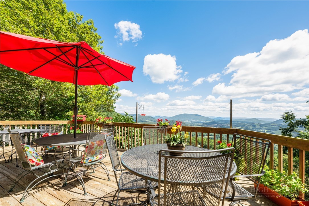 2177 Homestead Road Todd, NC 28684 - Photo 32 of 49 a view of a balcony with chair and table