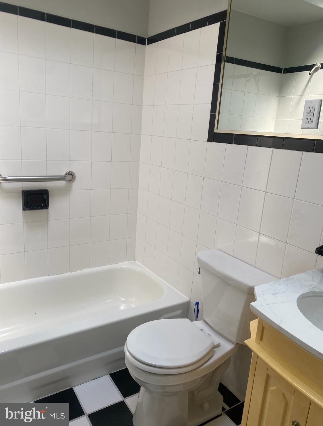 1738 Stocker Street Philadelphia, PA 19145 - Photo 5 of 8 a white toilet sitting next to a bath tub