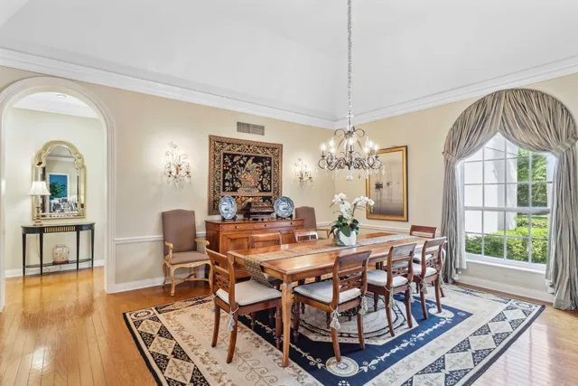 a large white kitchen with a large window