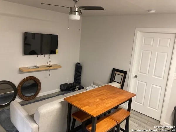 a view of a livingroom with furniture and a flat screen tv