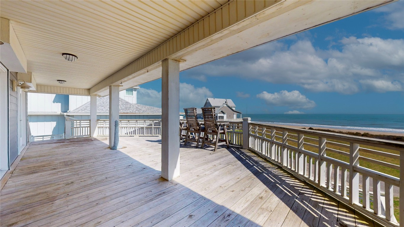3433 Sand Castle Lane Crystal Beach, TX 77650 - Photo 13 of 30 a view of balcony with wooden floor
