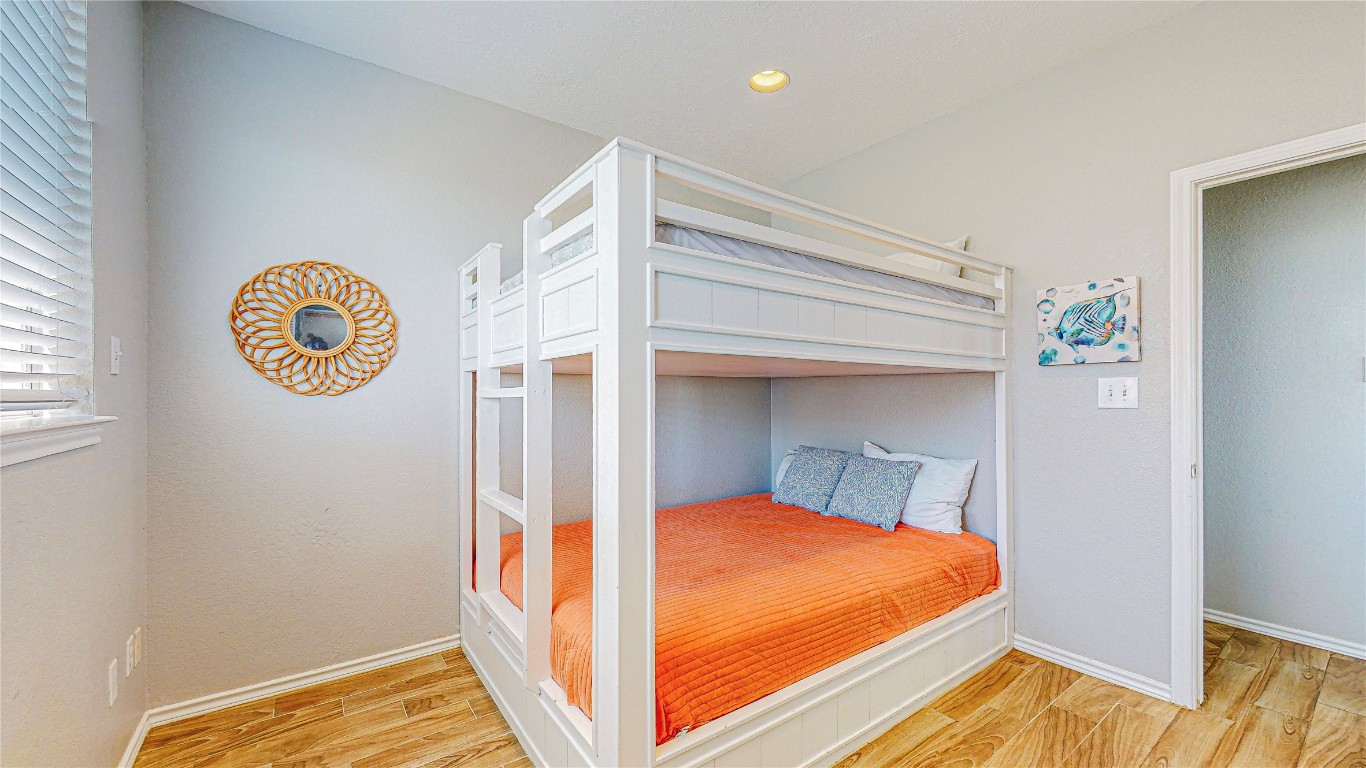 3433 Sand Castle Lane Crystal Beach, TX 77650 - Photo 15 of 30 a bed room with a bed and a window