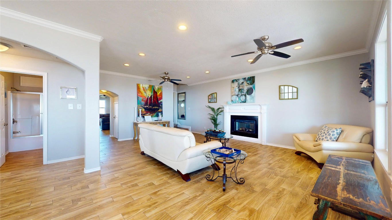 3433 Sand Castle Lane Crystal Beach, TX 77650 - Photo 18 of 30 a living room with furniture fireplace and window