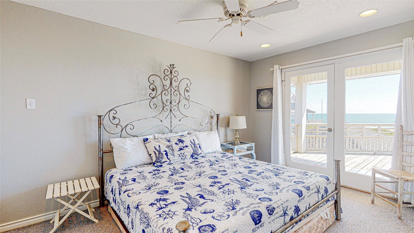 3433 Sand Castle Lane Crystal Beach, TX 77650 - Photo 20 of 30 a bedroom with a bed and a window