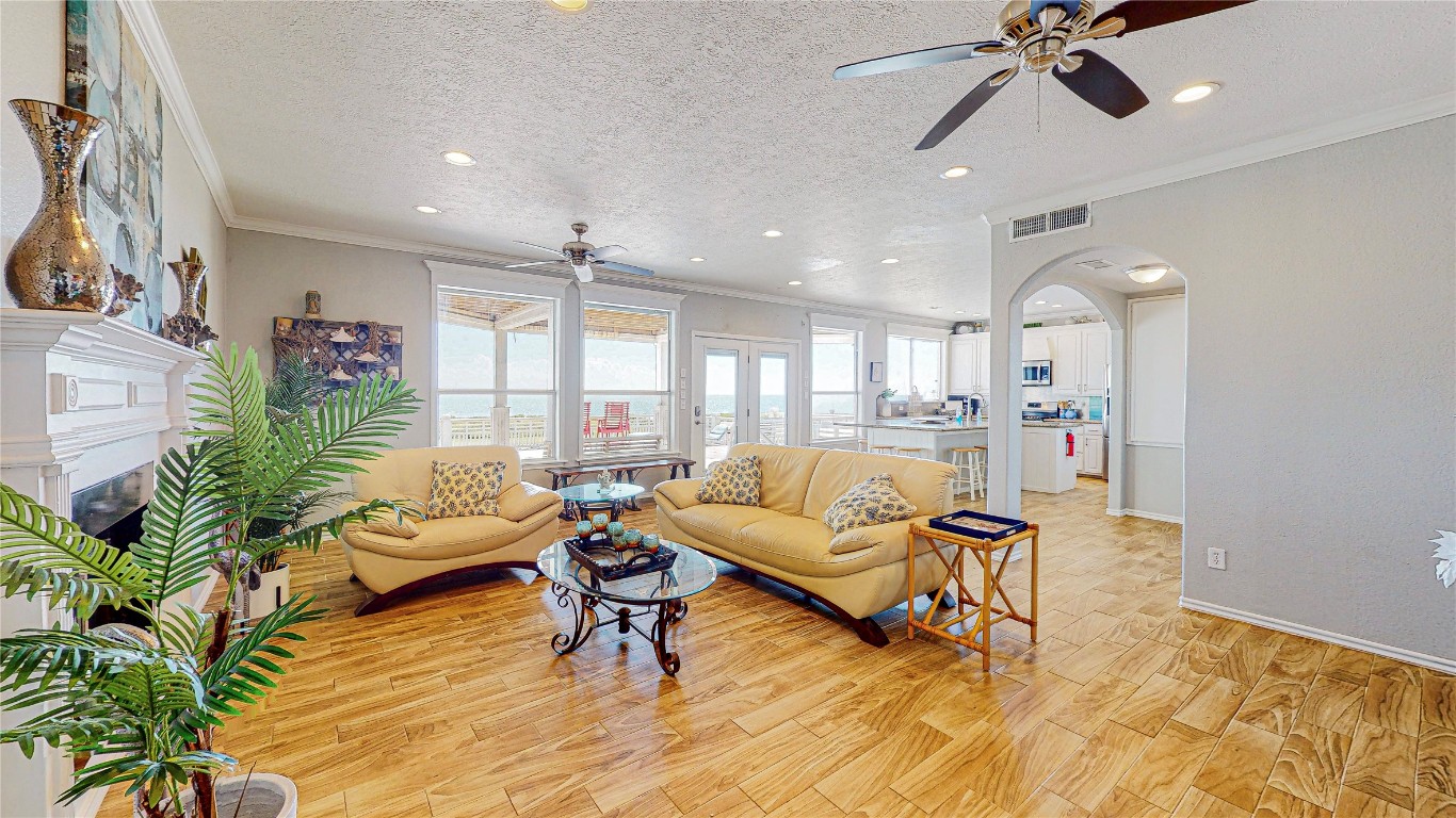 3433 Sand Castle Lane Crystal Beach, TX 77650 - Photo 7 of 30 a living room with furniture and a wooden floor