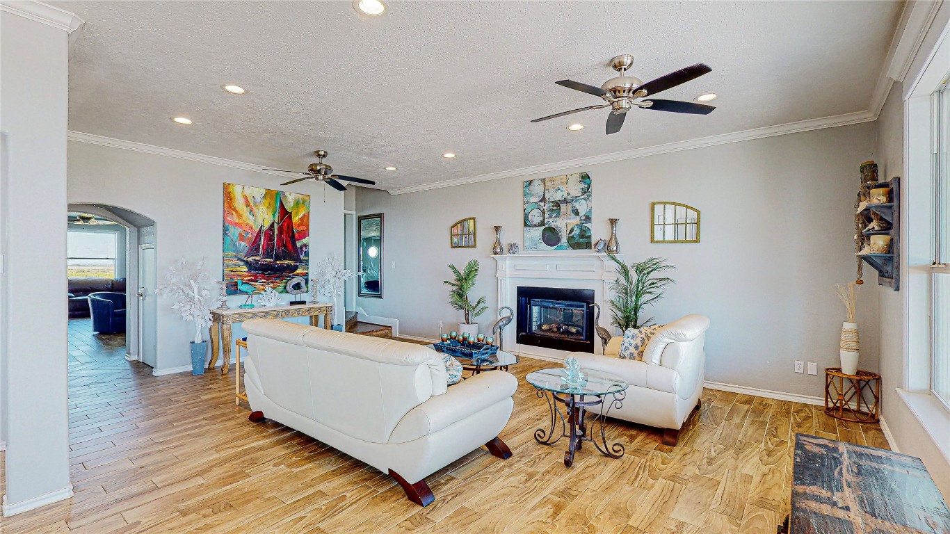 3433 Sand Castle Lane Crystal Beach, TX 77650 - Photo 8 of 30 a living room with furniture and a fireplace