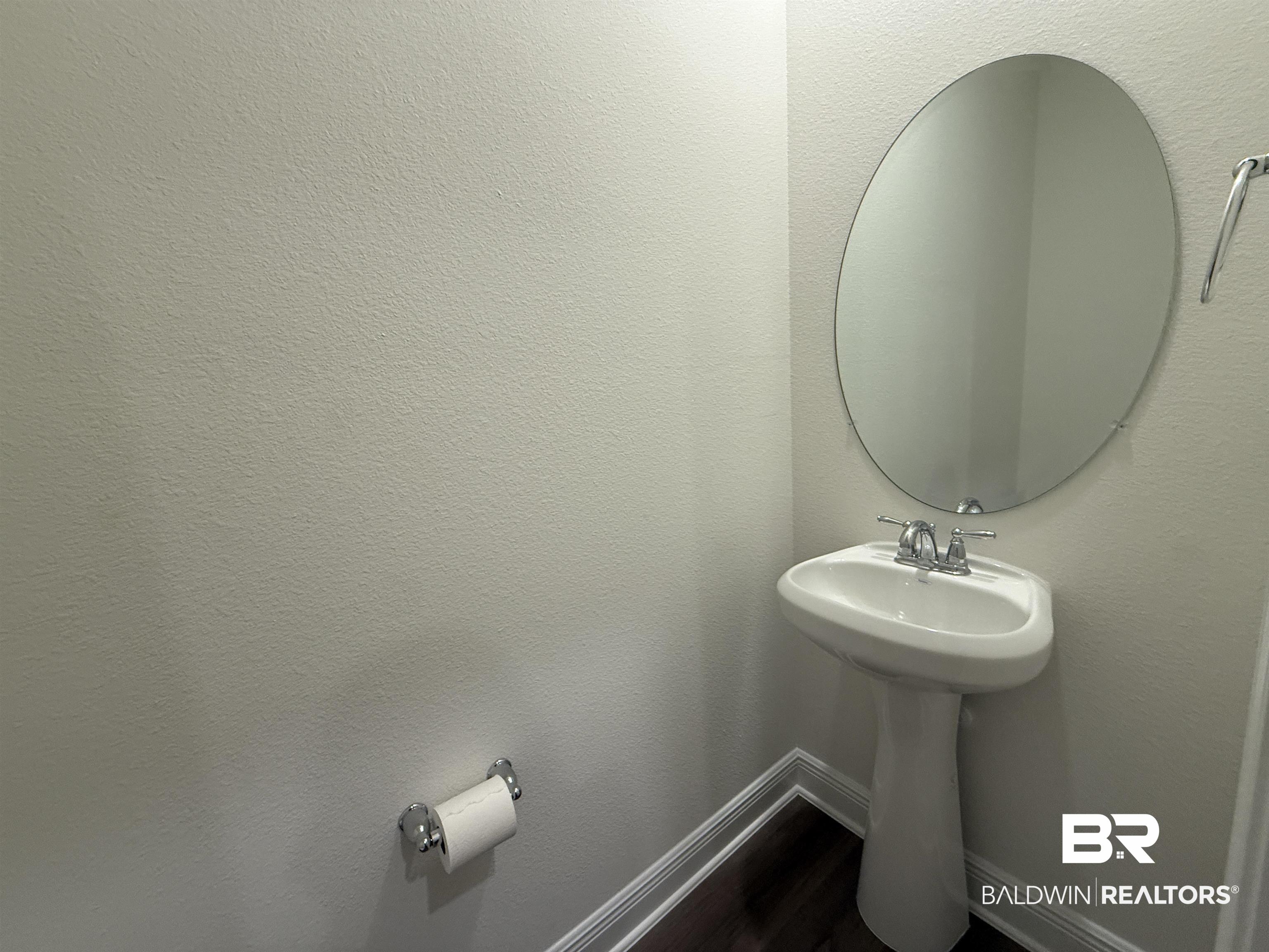 11442 Genuine Risk Circle Daphne, AL 36526 - Photo 8 of 21 Bathroom with baseboards and dark wood-style flooring