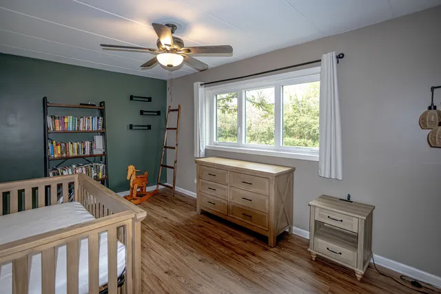 a bedroom with furniture and a window