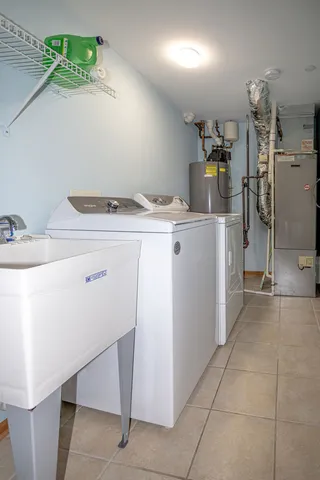 a utility room with washer and dryer