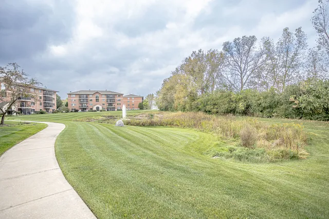 a view of a lake with a yard