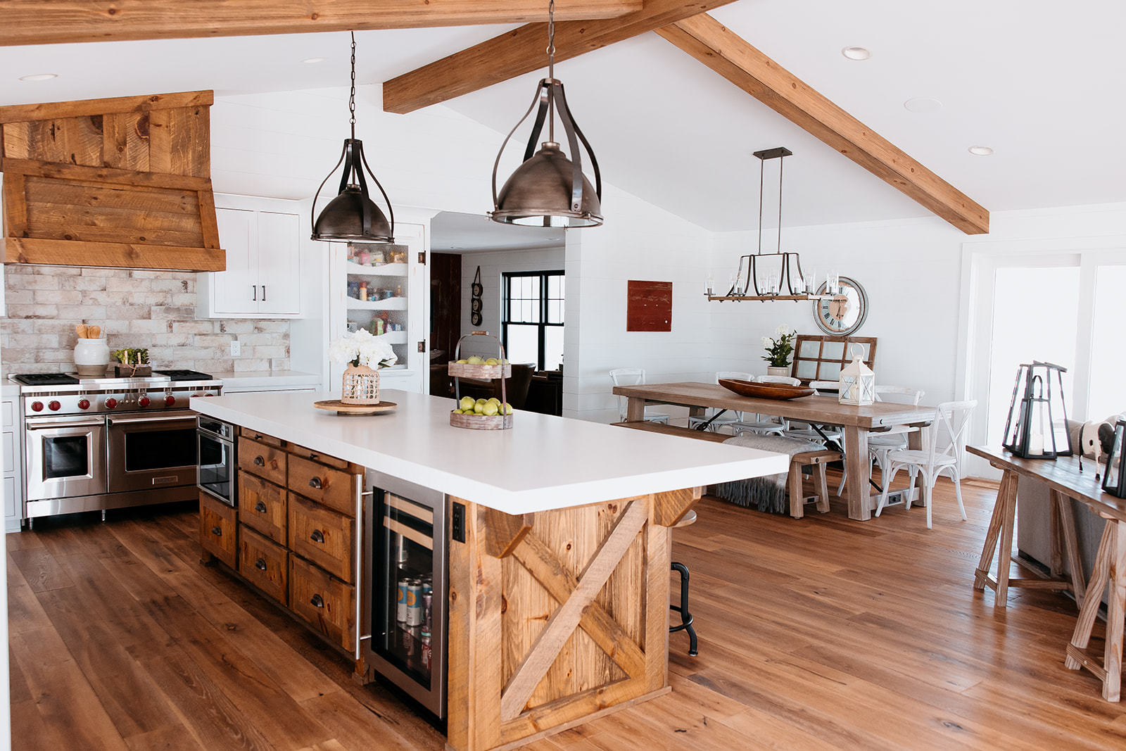 281 North Snipehollow Road Elizabeth, IL 61028 - Photo 11 of 68 a kitchen with stainless steel appliances a stove a sink a dining table and chairs with wooden floor