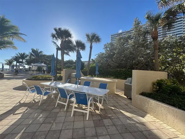 a view of a balcony with an ocean view