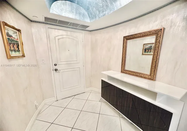 a bathroom with a sink a mirror and a shower