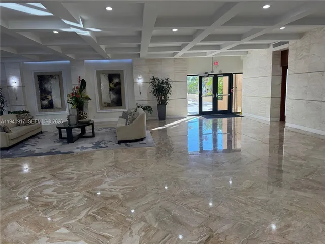 a dining room with furniture and view of kitchen