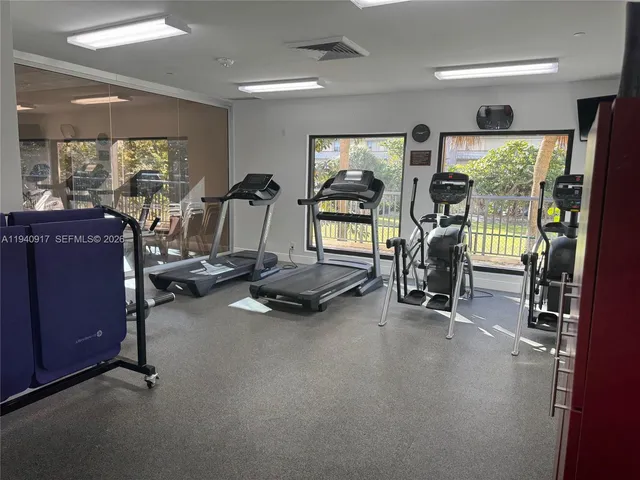 a bathroom with a mirror and a shower
