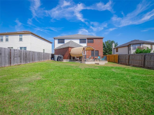 a front view of house with yard and outdoor seating