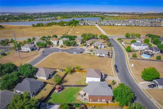 an aerial view of a city and lake view