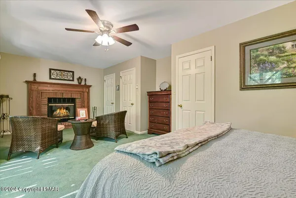a bedroom with a bed and a fireplace