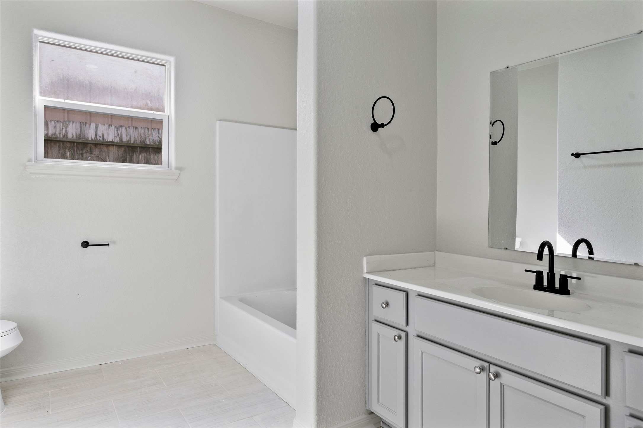 4415 Castor Street Houston, TX 77022 - Photo 12 of 21 a bathroom with a sink and mirror