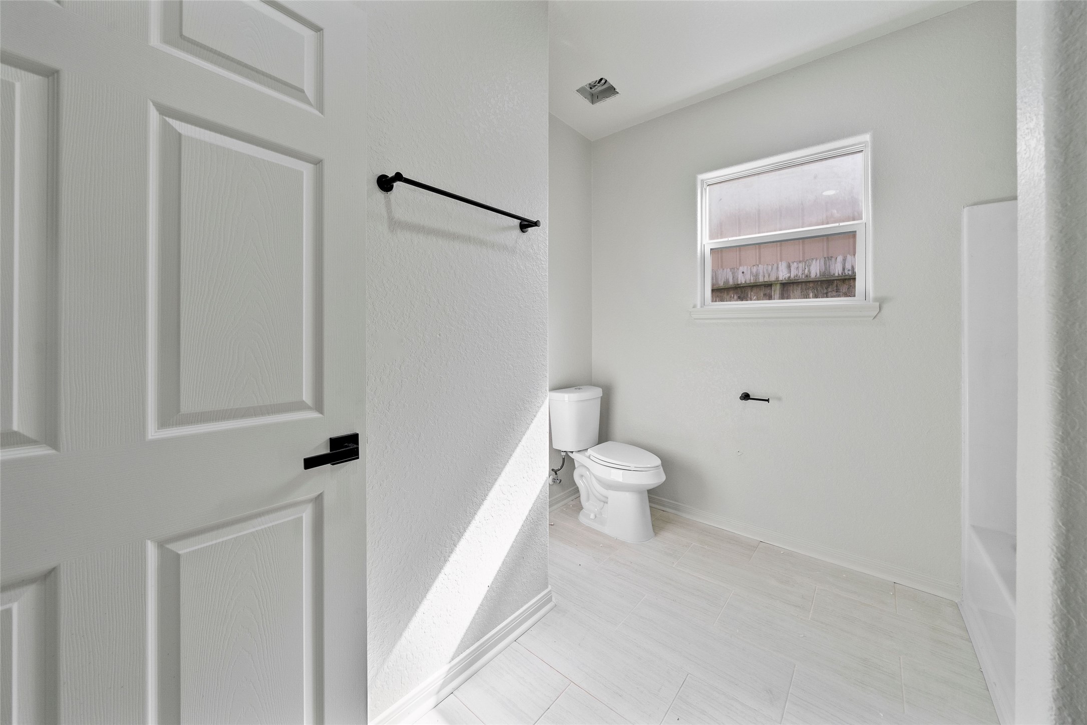 4415 Castor Street Houston, TX 77022 - Photo 13 of 21 a white toilet sitting next to a bathroom sink