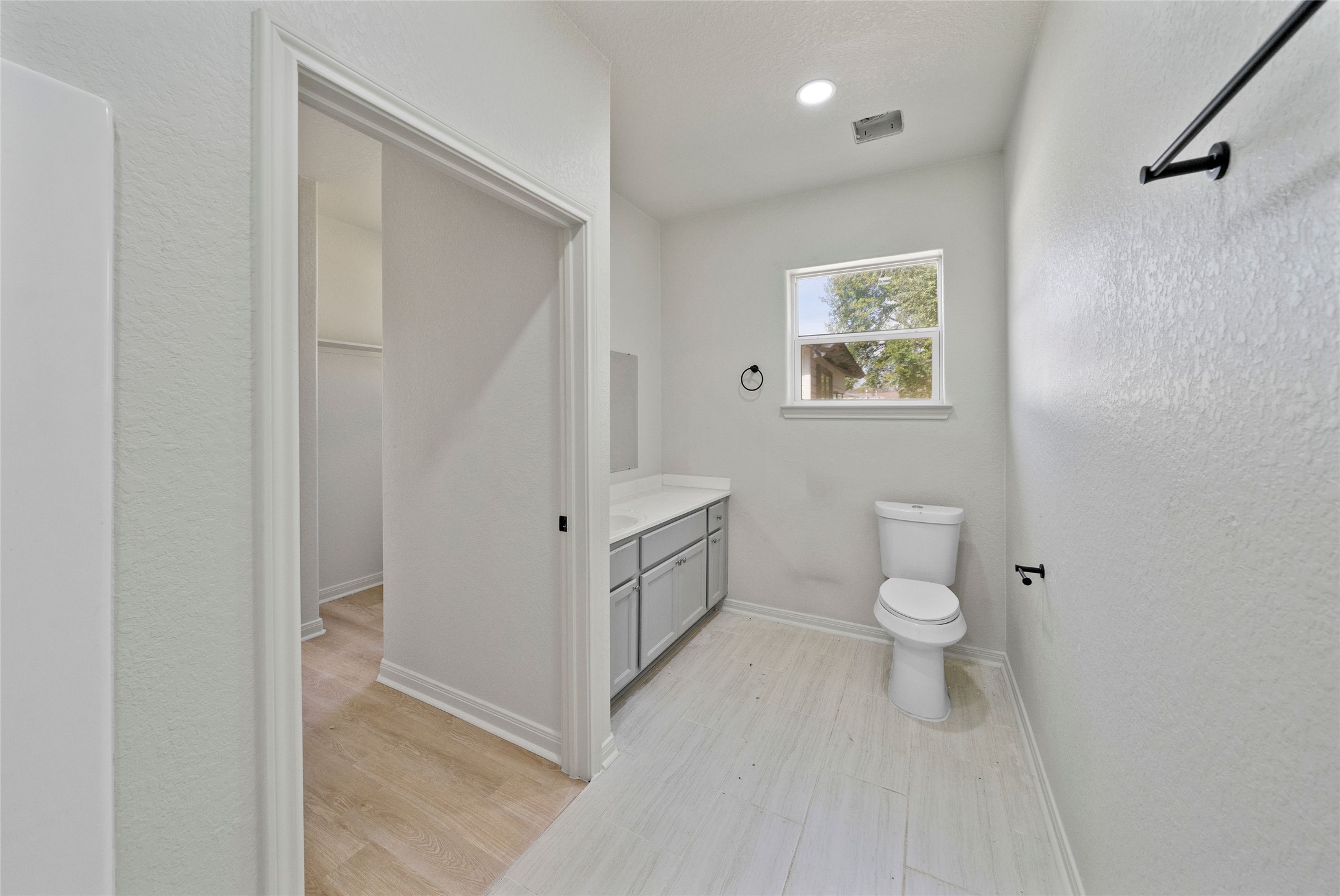 4415 Castor Street Houston, TX 77022 - Photo 19 of 21 a white toilet sitting next to a bathroom sink