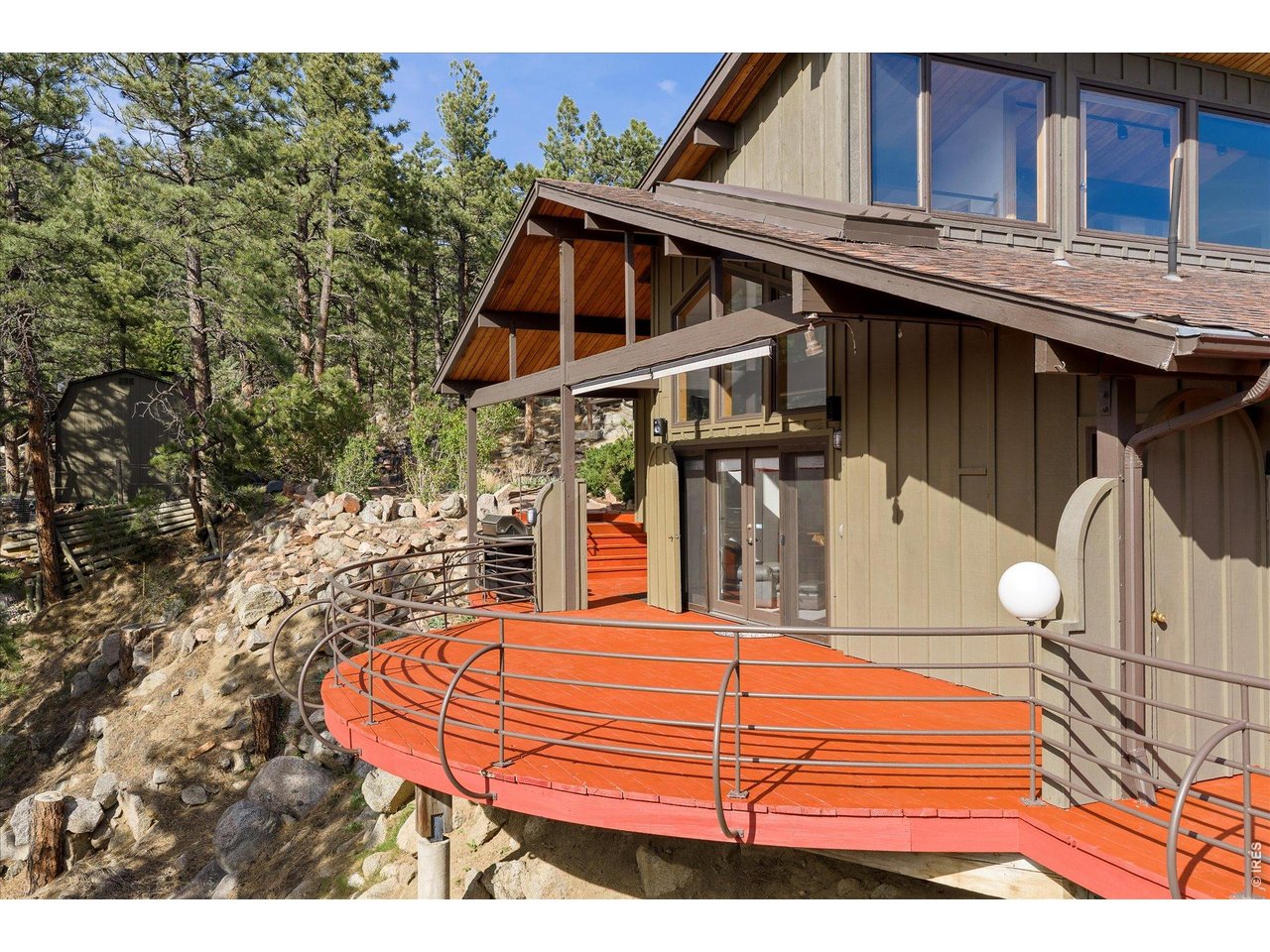 135 Poorman Road Boulder, CO 80302 - Photo 2 of 50 a view of a balcony with a table and chairs