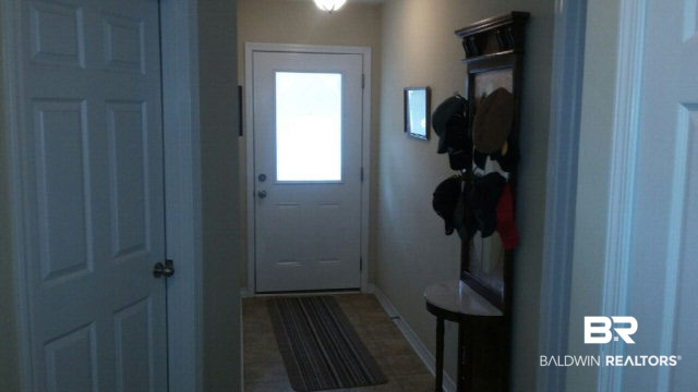 8877 Fall Court Mobile, AL 36695 - Photo 8 of 27 The long foyer greets your guests. Laundry room and garage entrance off foyer. This home has been decorated in a neutral pallet, so easy to add your own special stamp.