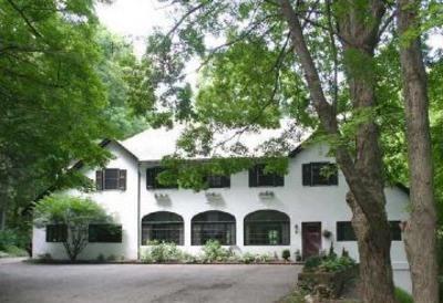 257 West Mountain Road Ridgefield, CT 06877 - Photo 1 of 1 a view of a white house with large trees