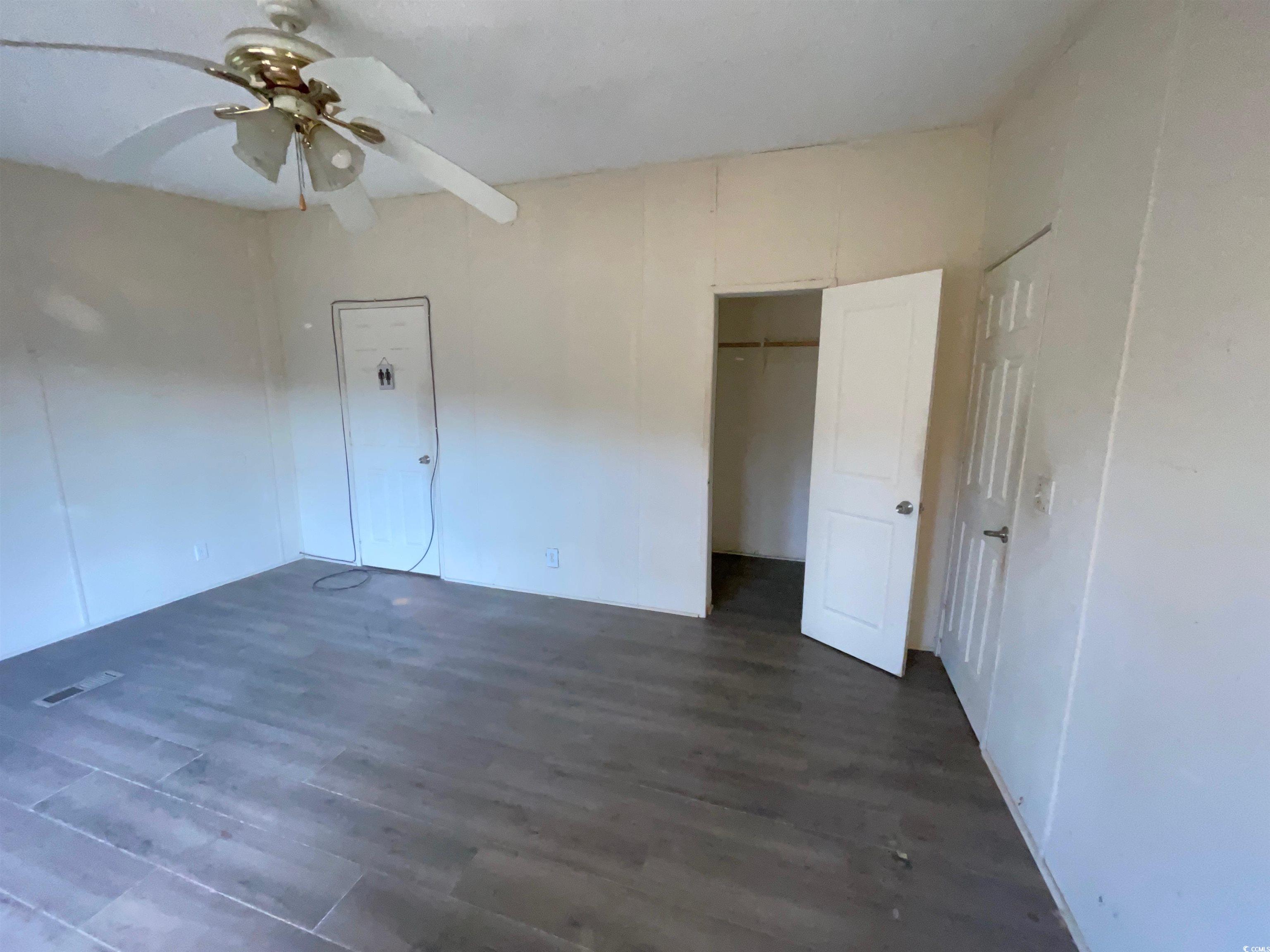 1121 County Rd S-45-222 Andrews, SC 29510 - Photo 20 of 25 Unfurnished bedroom with visible vents, a closet,