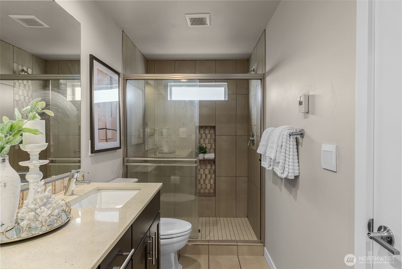 14913 48th Avenue West, Unit K1 Edmonds, WA 98026 - Photo 13 of 31 a bathroom with a granite countertop sink a toilet and shower