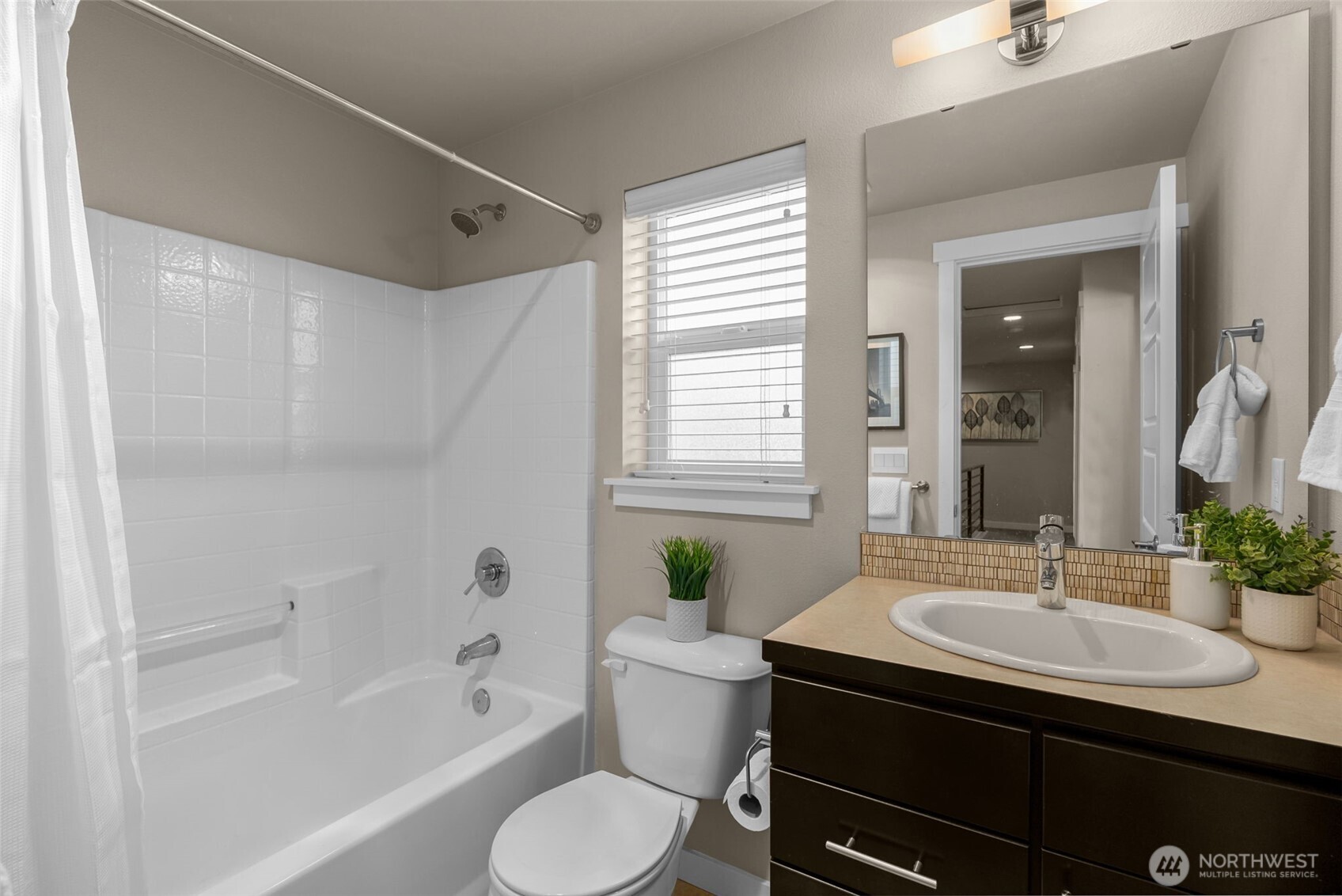 14913 48th Avenue West, Unit K1 Edmonds, WA 98026 - Photo 19 of 31 a bathroom with a sink a toilet a mirror and shower